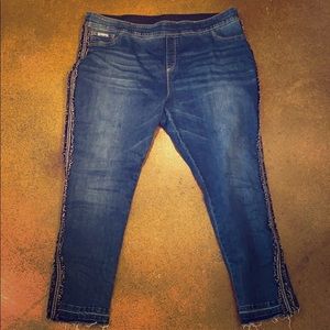 Blue jeans with cute accent details on the sides.